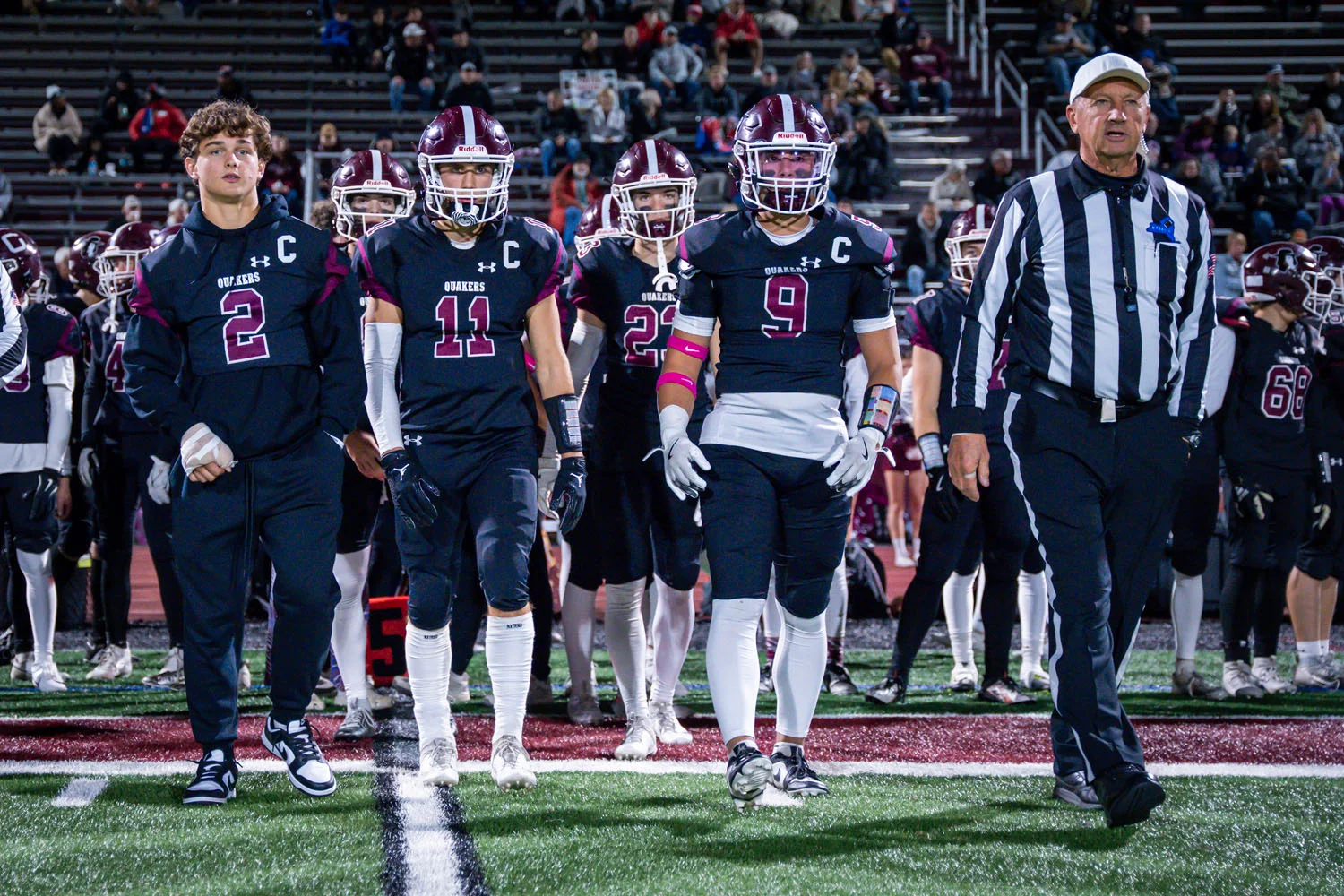 Captians headed to the coin toss Captians headed to the coin toss