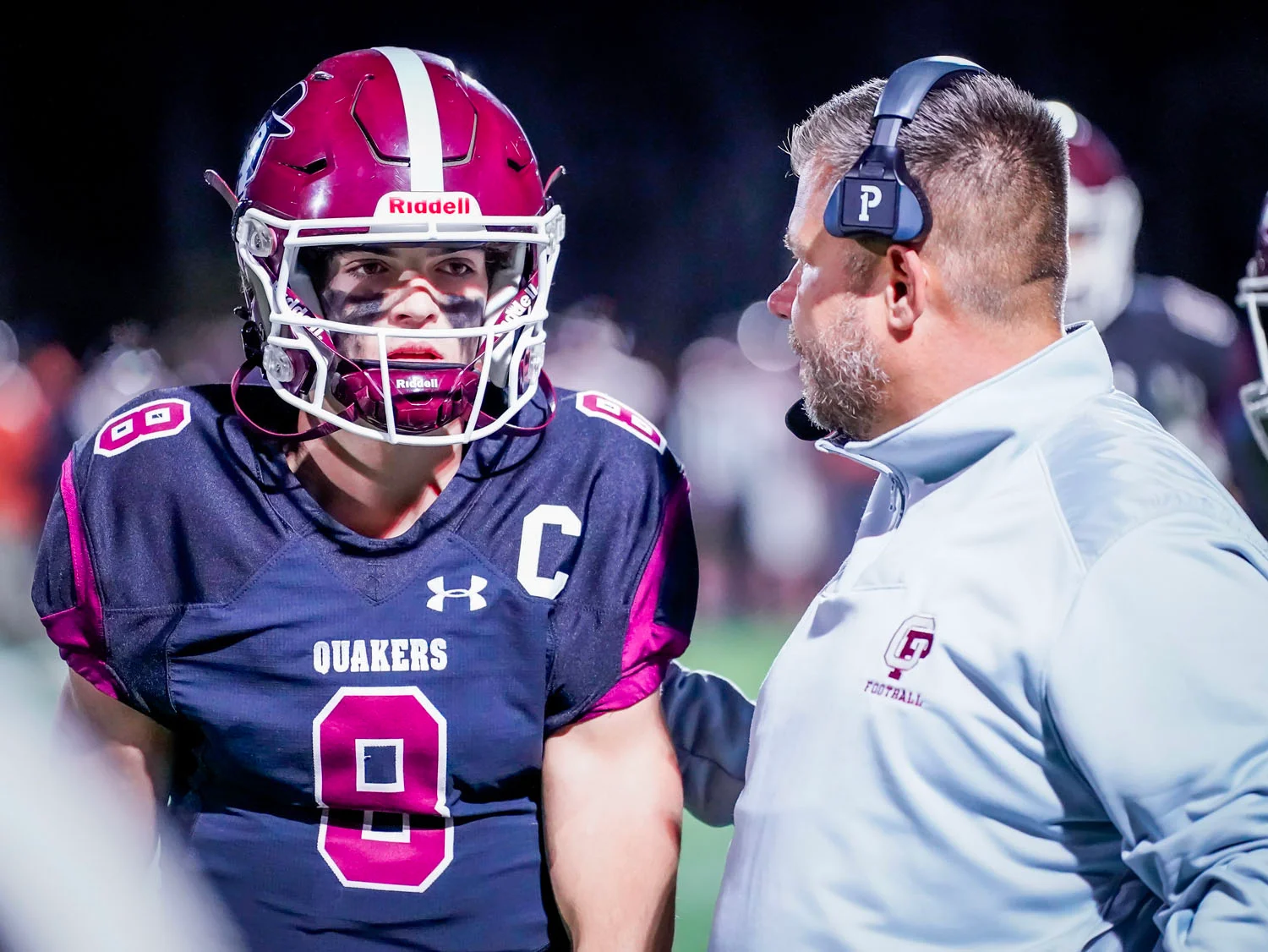 Coach talking to his QB Coach talking to his QB