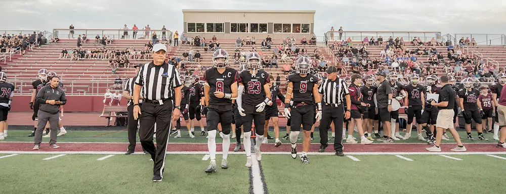 The OP Captains coming out on the field for the coin toss The OP Captains coming out on the field for the coin toss